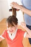 Girl Unhappy with having Hair Brushed