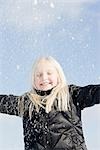 Girl Playing in Snow