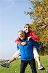 Man Giving Woman Piggy Back Ride