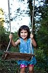 little girl with swing,laughing