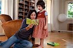 mother reading to daughter