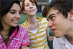 Teenage boy playfully looking at girl friend with playful expression