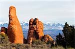 USA,Utah,Arches National Park,snow capped mountains of Manti La Sal National Forest and sandstone pinnacles at the Devils Garden