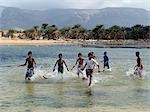 Children enjoy a boat race in a lagoon at Qalansiah,an important fishing village in the northwest of Socotra Island.