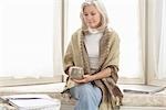 Woman at Home Relaxing With a Cup of Coffee