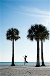 Man Practicing Yoga on Beach, Hernando Beach, Florida, USA