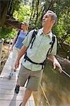 Couple Hiking Through a Forest of Old Growth Redwoods, Near Santa Cruz, California, USA