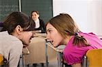Students Whispering in Class