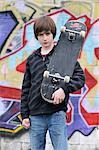 Portrait of Boy With Skateboard