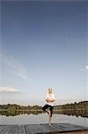 Young woman doing yoga exercise