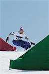 Man  taking Heelside Turn while Snowboarding