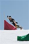 Snowboarder  Riding Snowboard on Snowfield