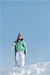 Woman  Standing with Snowboard on Snowfield