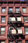 Classic old tenement building with fire escape, Chinatown, Manhattan, New York City, United States of America, North America