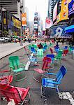 Garden chairs in the road for the public to sit and relax in the pedestrian zone, Times Square, New York City, New York, United States of America, North America