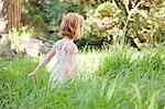 Little girl in field of grass