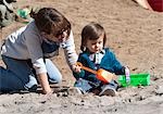 Mother and Son Playing in Sand