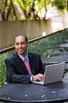 Businessman Using Laptop Computer Outdoors
