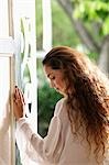 Profile of woman with long hair in doorway