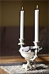Candleholder with candles on a table, close-up