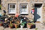 Crab pots outside a beautiful and traditional fishing cottage at Penberth, Cornwall, England, United Kingdom, UK, Europe