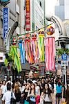 A Shibuya side stree, full of colourful signs and adverts, Tokyo, Japan.