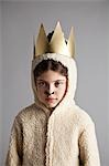 Young girl dressed up as sheep, wearing gold crown