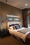 Pendant lights in bedroom with silk furnishings
