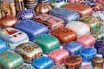 Assorted containers at a market stall