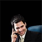 Businessman talking on a mobile phone and smiling