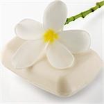 Close-up of a bar of soap with a flower