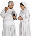 Priest talking to a nun