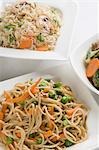 Close-up of noodles and fried rice in bowls