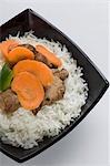 Close-up of meat with white rice in a bowl