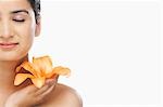 Close-up of a woman holding a flower