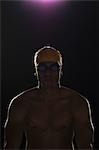 Close-up of a swimmer in dark