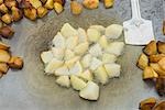 Close-up of potato slices on a griddle