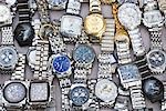 Close-up of wristwatches on a stall