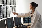 Female doctor examining an X-Ray report