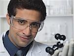 Scientist holding molecular model in a laboratory