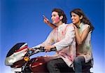 Couple riding a motorcycle