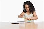 Close-up of a girl holding a pencil