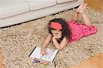 High angle view of a girl drawing a picture