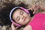 Close-up of a girl listening to headphones