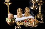 Diwali thali in front of idols of Lord Ganesha and Goddess Lakshmi