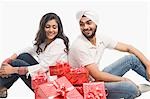 Couple sitting with gifts