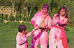Family celebrating Holi with colors