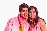 Portrait of a couple celebrating Holi