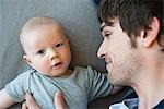 Baby boy with Dad looking to camera