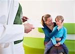 Doctor with patient in waiting area